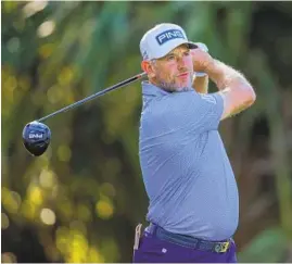  ?? KEVIN C. COX GETTY IMAGES ?? Lee Westwood plays his shot from the seventh tee during the second round of The Players Championsh­ip. Westwood has the lead after a bogey-free 6-under 66.