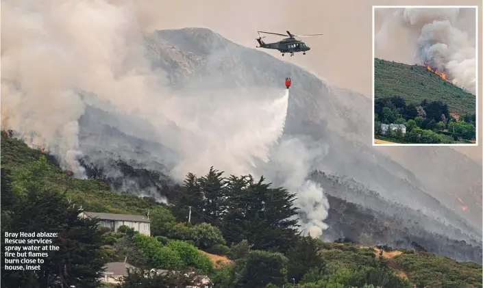  ??  ?? Bray Head ablaze: Rescue services spray water at the fire but flames burn close to house, inset