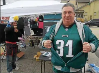  ?? PETE BANNAN — DIGITAL FIRST MEDIA ?? Joe Seefeldt of Glenolden proudly shows off his Eagles jersey, one of 40 he owns.