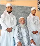  ??  ?? Suleima Lebbe Mohammed Aliyaar, Vice Principal of the Jamiathul Falah Arabic College in Kattankudy with two of his students in 2014