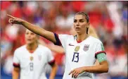  ?? RICHARD HEATHCOTE / GETTY IMAGES ?? U.S. Women’s National Team standout Alex Morgan appeared in the Sports Illustrate­d swimsuit issue. The picture, she said, “shows me how strong I am and how hard I’ve worked.”