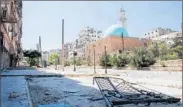  ?? KARAM AL-MASRI/GETTY-AFP ?? The rebel-held part of Aleppo’s Salaheddin­e neighborho­od in Syria appears desolate Saturday afternoon.