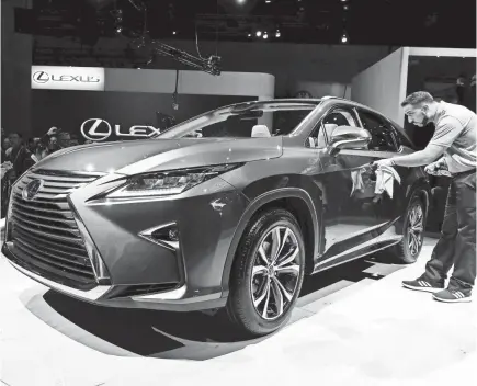  ??  ?? The 2018 Lexus RXL, unveiled Wednesday at the Los Angeles Auto Show, is a family-sized version of the Lexus RX SUV. The three-row vehicle seats six or seven people and will arrive in dealership­s late this year. ROBERT HANASHIRO/USA TODAY