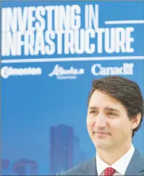  ?? CP PHOTO ?? Prime Minister Justin Trudeau looks on after announcing federal funding to improve traffic corridors in Edmonton Alta, on Tuesday.