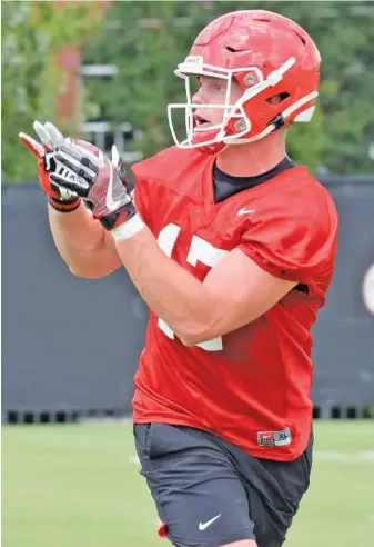  ?? GEORGIA PHOTO/STEVEN COLQUITT ?? Georgia tight end Eli Wolf, a graduate transfer from Tennessee, goes through a workout in Athens earlier this month. Wolf gives the Bulldogs a veteran presence at a position where they return little experience.