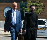  ?? (Arkansas Democrat-Gazette/Stephen Swofford) ?? Damien Echols (right) leaves the West Memphis District Courthouse on Thursday with his lawyer, Patrick Benca, after a bid for new DNA testing in the 1993 slayings of three West Memphis boys was denied. More photos at arkansason­line.com/624wm3/.