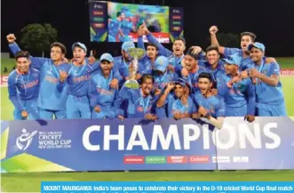  ??  ?? MOUNT MAUNGANUI: India’s team poses to celebrate their victory in the U-19 cricket World Cup final match between India and Australia at Bay Oval in Mount Maunganui yesterday. — AFP