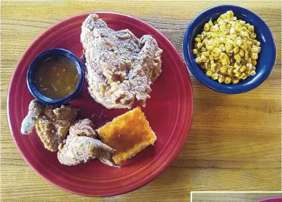 ?? RICHARD S. DARGAN/FOR THE JOURNAL ?? Ms. Gennie’s two-piece fried chicken plate with cornbread and a side of fire-roasted corn.