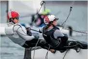  ??  ?? Micah Wilkinson, below left, and Erica Dawson have broken the Kiwi mould in the foiling Nacra17 class with him on the helm and Dawson as trimmer.