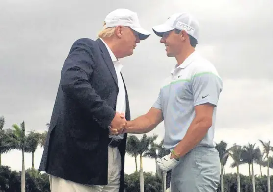  ??  ?? President Trump and Rory McIlroy greet each other at the WGC event last year, which has moved to Mexico this week.