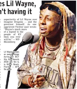  ?? — AFP file photo ?? Lil Wayne accepts an award onstage during the BET Hip Hop Awards 2018 last Oct 6, in Miami Beach, Florida.