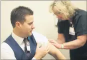  ?? CONTRIBUTE­D ?? Judson Howe, financial officer for Adventist Health in Mendocino County, gets his annual flu shot.