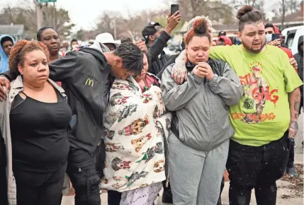  ?? AARON LAVINSKY/STAR TRIBUNE VIA AP ?? Katie Wright, center, the mother of 20-year-old Daunte Wright, is comforted Sunday after her son was shot and killed during a traffic stop in Brooklyn Center, Minn., just miles north of Minneapoli­s where an officer is on trial in the death of George Floyd. The officer who shot Wright meant to use a Taser, the police chief said.