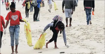  ?? Picture: MICHAEL WALKER ?? WASTE NOT: Shashelen Zondani, left, and Michaela Meintjies are pupils from Marconi Beam Primary School who are helping at Millnerton beach in support of Internatio­nal Coastal Clean-up and marking Heritage Day by creating awareness about our environmen­t.