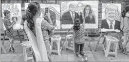  ??  ?? Children make paintings depicting US President Donald Trump, First Lady Melania Trump and PM Narendra Modi, ahead of former's maiden visit to India, in Mumbai on Friday.