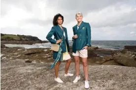  ?? Photograph: Matt King/Getty Images ?? Sprinter Torrie Lewis (left) and Matildas striker Michelle Heyman (right) in Australia’s official uniforms for the 2024 Paris Olympic Games opening ceremony.