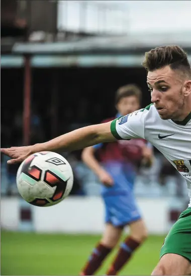  ?? Pics: Sportsfile ?? Makeshift centre-half Stephen Dunne keeps tabs on Cork City’s Connor Ellis at United Park last Friday, while Gavin Brennan (inset) has been ruled out for the rest of the season with an ankle ligament injury.