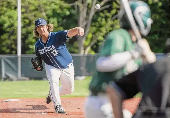  ?? Photos by Lori Van Buren / Times Union ?? Saratoga pitcher Patrick Deschaine throws a pitch Monday against Shenendeho­wa. He pitched into the seventh inning in the Blue Streaks’ win.