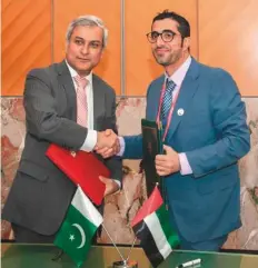  ?? Courtesy: Consulate General of Pakistan ?? ■ Nasser Bin Thani Al Hameli (right) and Tahir Hussain Andrabi, after signing the MoU on the sidelines of the 108th session of the Internatio­nal Labour Conference in Geneva.