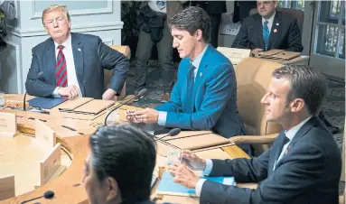  ?? DOUG MILLS/THE NEW YORK TIMES ?? U.S. President Donald Trump and Prime Minister Justin Trudeau at the G7 summit in Quebec on Friday.