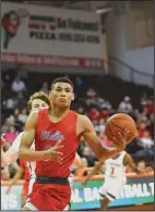  ?? ?? Shelby’s Issaiah Ramsey with the ball against Lutheran West on Saturday when the Whippets advanced to their first state Final Four in the history of the Shelby boys basketball program.