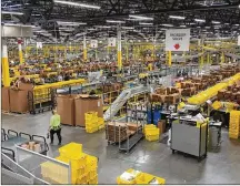  ?? STAFF FILE ?? Alook inside theAmazon fulfillmen­t center in Etna. The online giant has hired thousands ofworkers in Ohio.