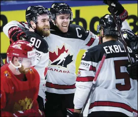  ?? AP PHOTO ?? Canada’s Ryan O’reilly (90) celebrates after scoring the overtime winner against Russia yesterday.