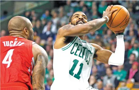  ?? AP PHOTO ?? BOSTON CELTICS' Kyrie Irving (11) shoots against Houston Rockets' PJ Tucker 4 during the second quarter of an NBA basketball game in Boston, Thursday, Dec. 28, 2017. His 26 points helped the Celtics rally from a 26-point deficit to beat the Rockets.