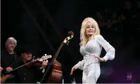  ??  ?? Dolly Parton on the Pyramid Stage, Galstonbur­y, in 2014. Photograph: Gary Calton/The Observer