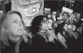  ?? LEO CORREA/AP PHOTO ?? Families and supporters of Israeli hostages held by Hamas in Gaza attend a rally Saturday calling for their return in Tel Aviv, Israel. More than 100 Israeli hostages are held in Gaza after being abducted in a Hamas cross-border attack on Oct. 7.