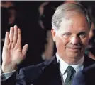  ?? AP ?? Sen. Doug Jones, D-Ala., takes the oath of office during a mock swearing-in Wednesday.