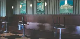  ??  ?? Chairs are flipped over on socially distanced tables Wednesday at Barnes and Noble Cafe in Los
Angeles.