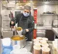  ?? Contribute­d photo ?? Sodexo employee Willians Pena at Boehringer Ingelheim Pharmaceut­icals commercial kitchen in Ridgefield prepares food for Danbury residents in a program managed by Food Rescue and the United Way.