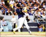  ?? AFP ?? Orlando Arcia of the Milwaukee Brewers hits a two-run home run on Monday.