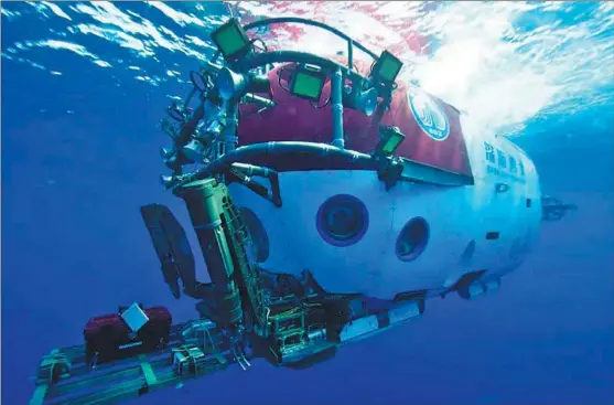  ?? PHOTOS PROVIDED TO CHINA DAILY ?? The manned submersibl­e Shenhai Yongshi, or Deep Sea Warrior, is launched on May 20 for the first exploratio­n mission involving two shipwrecks at a depth of about 1,500 meters in the South China Sea.