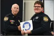  ?? MEMPHIS POLICE DEPARTMENT VIA AP ?? In this photo obtained from the Memphis Police Department’s Facebook page, Preston Hemphill receives a certificat­e from Memphis Assistant Chief of Police
Don Crowe after completing the training to join the department’s Crisis Interventi­on Team on July 21, 2022.