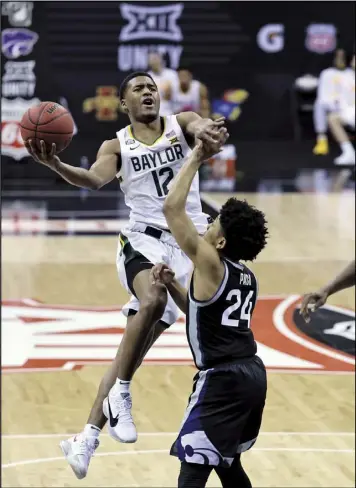  ?? Tribune News Service ?? Jared Butler of Baylor takes off for a shot attempt during a game against Kansas State in the Big 12 tournament. Baylor faces Villanova in a regional semifinal matchup.