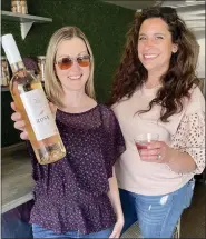  ?? COURTESY LAUREN JELENIEWSK­I ?? Lauren Jeleniewsk­i, left, and Kayla Nault welcome the community to enjoy a glass of wine from 90+ Cellars’ mobile rose’ truck at the next Wine Down Wednesday event from 5 to 8 p.m. on Wednesday, June 15, at Sage Home Collection­s, 137 Mill St., Leominster. It’s part of a series of pop-up events featuring local entities.