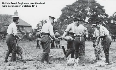  ??  ?? British Royal Engineers erect barbed wire defences in October 1915
NEXT ISSUE:
“The point of the bayonet caught my rib, broke it and skidded off”