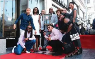  ??  ?? Comedian Tracy Morgan (center) poses with the cast from ‘The Last O.G’ on his Hollywood Walk of Fame Star on April 10, 2018 in Hollywood, California. — AFP photos