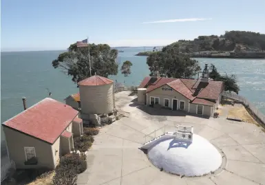  ?? Photos by Liz Hafalia / The Chronicle 2019 ?? A 147yearold Victorian lighthouse overlooks the buildings that comprise the East Brother Light Station Bed & Breakfast, located on a tiny island just 1,000 feet off Richmond’s Point San Pablo.