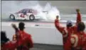  ?? STEVE HELBER — THE ASSOCIATED PRESS ?? The pit crew for Kyle Larson (42) celebrates after winning the NASCAR Cup Series auto race at Richmond Internatio­nal Raceway in Richmond, Va., Saturday.