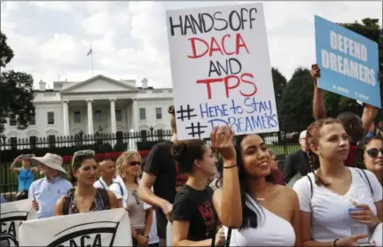  ?? JACQUELYN MARTIN ?? Yurexi Quinones, 24, of Manassas, Va., a college student who is studying social work and a recipient of Deferred Action for Childhood Arrivals, known as DACA, rallies next to Ana Rice, 18, of Manassas, Va., far right, in support of DACA, outside of the...