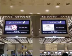  ?? — Reuters ?? Jet Airways flight informatio­n is seen at check-in counters inside the internatio­nal airport in Mumbai, India.