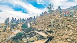  ?? PTI ?? Rescue operations underway after a massive landslide hit Tupul railway constructi­on camp in Noney district of Manipur, on Thursday.