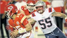  ?? AP ?? Patriots defensive end John Simon pressures Chiefs quarterbac­k Patrick Mahomes during the second half Monday.