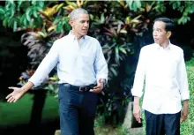  ??  ?? Former US President Barack Obama, left, walks with Indonesian President Joko Widodo during their meeting at the Botanical Garden near the presidenti­al palace in Bogor, Indonesia on Friday. (Reuters)