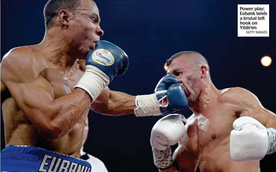  ?? GETTY IMAGES ?? Power play: Eubank lands a brutal left hook on Yildirim