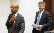  ?? PAUL VERNON / ASSOCIATED PRESS ?? Ohio State University President Michael Drake (left) and board of trustees chairman Michael Gasser leave to go into executive session Wednesday on the subject of head football coach Urban Meyer.