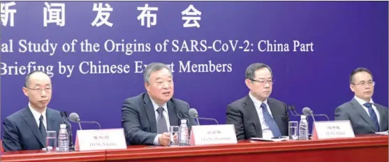  ?? 31. ZHANG YUWEI / XINHUA ?? Chinese expert members of a WHO-China joint team introduce the report on the WHO-convened global study of COVID-19 origins at a press briefing in Beijing on March